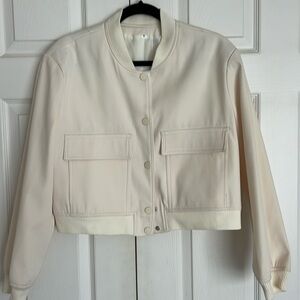Cream color bomber jacket.
